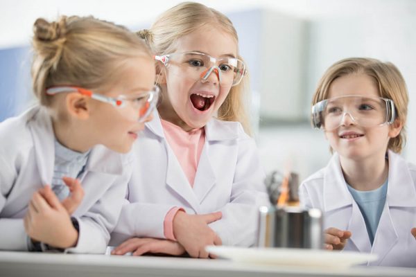 three-kids-wearing-protective-glasses-in-science-l-RTGFW2P.jpg